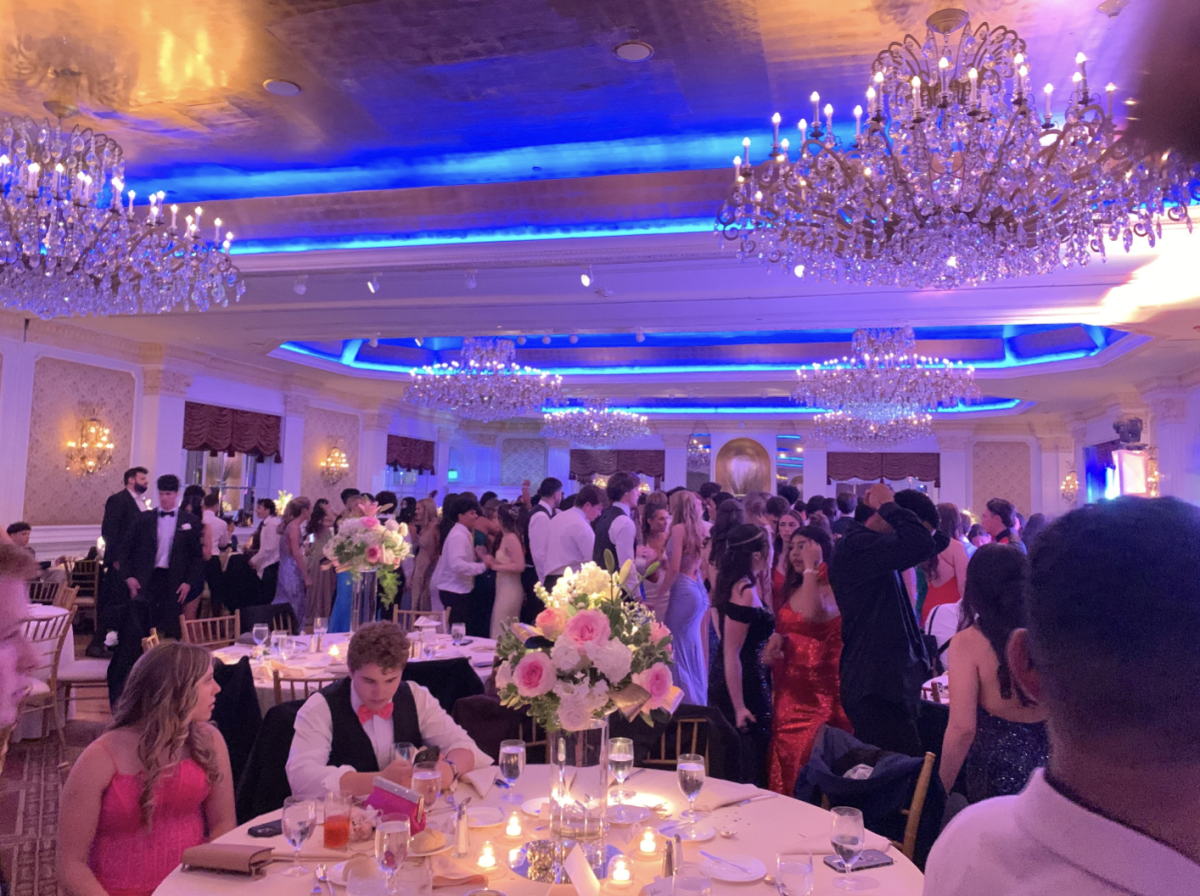 Seniors gather on the dance floor in celebration of their journey throughout high school.

